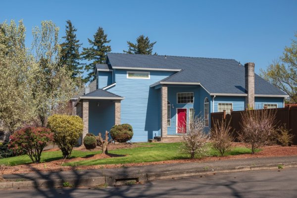 picture of a blue house from the road